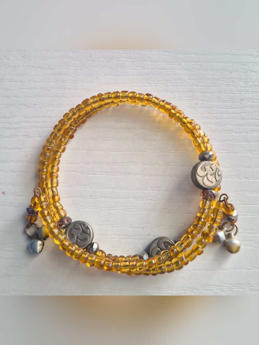 Multi Strand Yellow Wrap Bracelet With OM beads